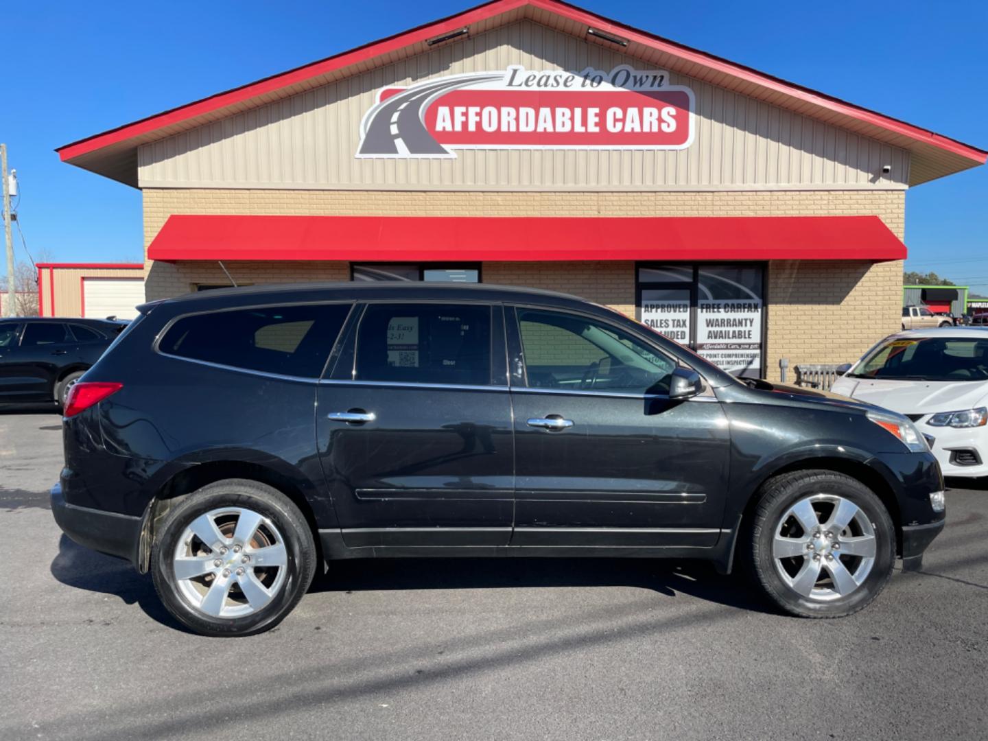 2012 Black Chevrolet Traverse (1GNKRGED7CJ) with an V6, 3.6 Liter engine, Auto, 6-Spd w/Shft Ctrl transmission, located at 8008 Warden Rd, Sherwood, AR, 72120, (501) 801-6100, 34.830078, -92.186684 - Photo#0